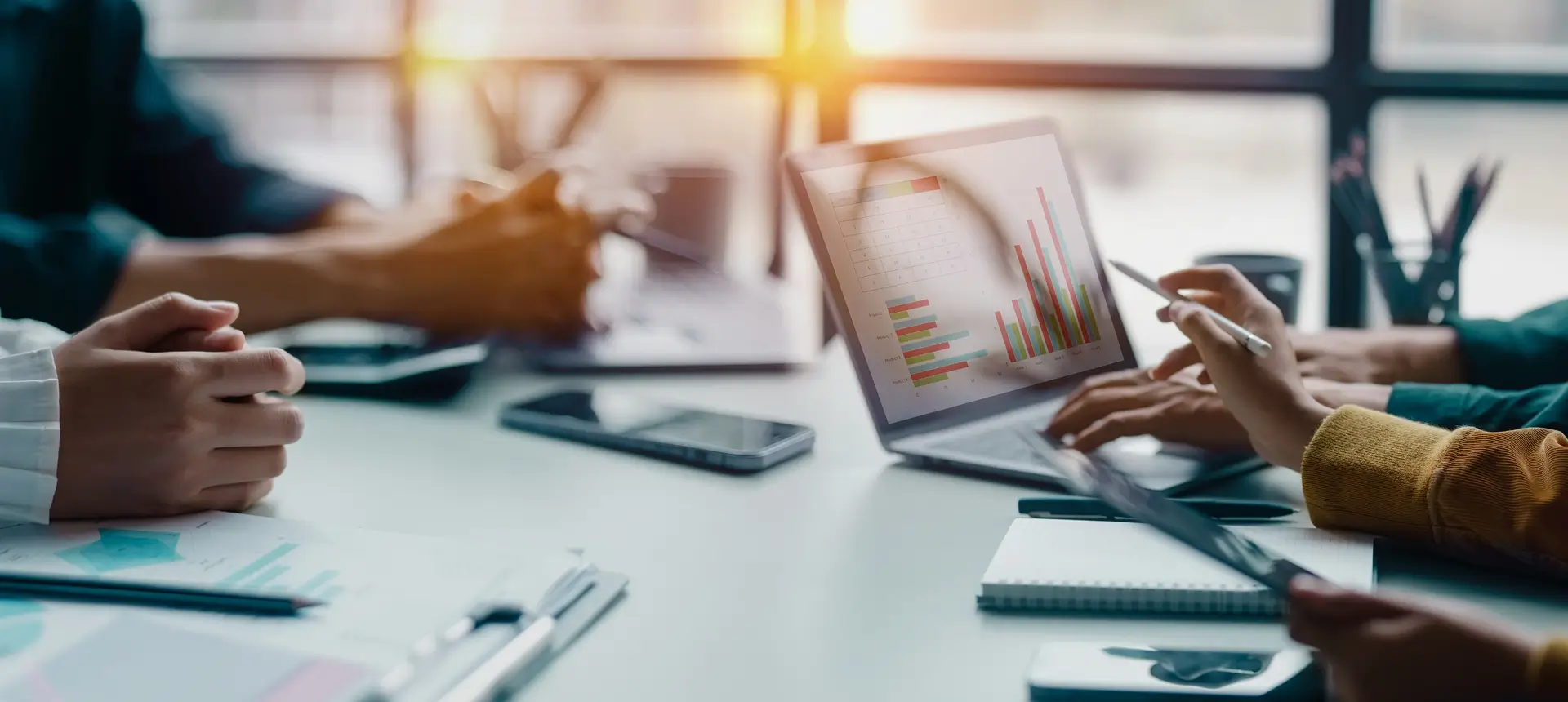 Team analyzing data on a laptop.