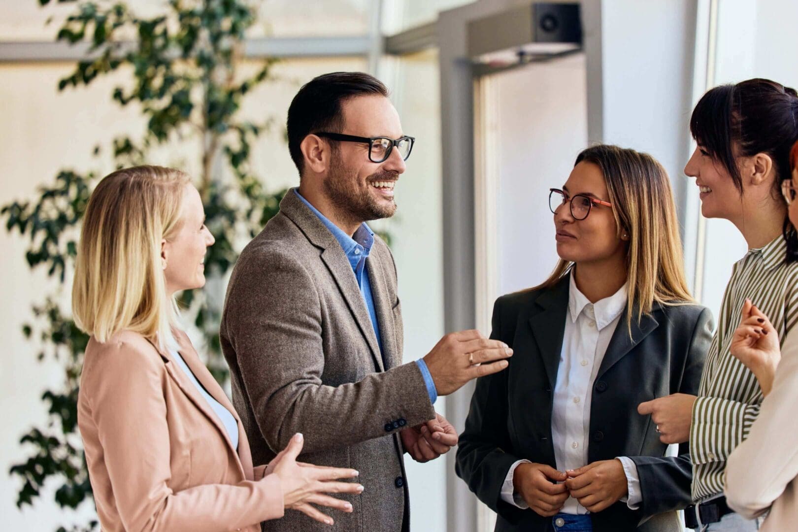 Group having a cheerful office conversation.