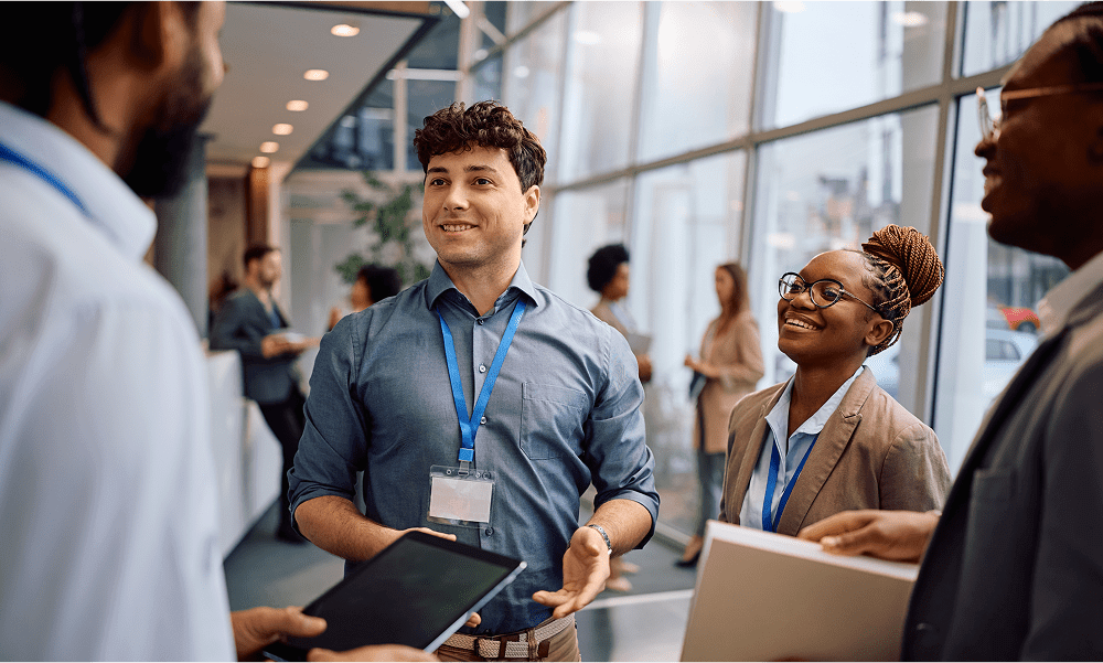 Professionals networking in a modern office setting.