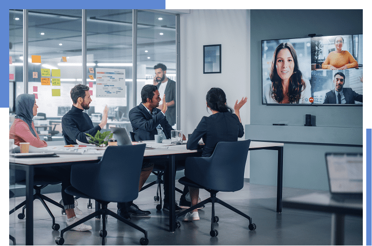 Office meeting with video conference participants.