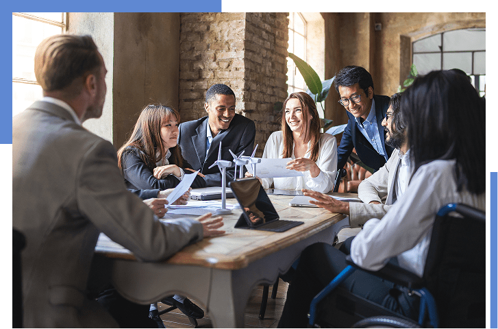 Diverse team in meeting around a table.