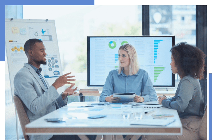 Business meeting with data presentation screens.